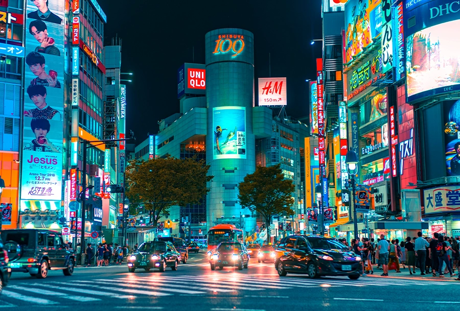 tokyo japan downtown nighttime cars traffic people walking busy