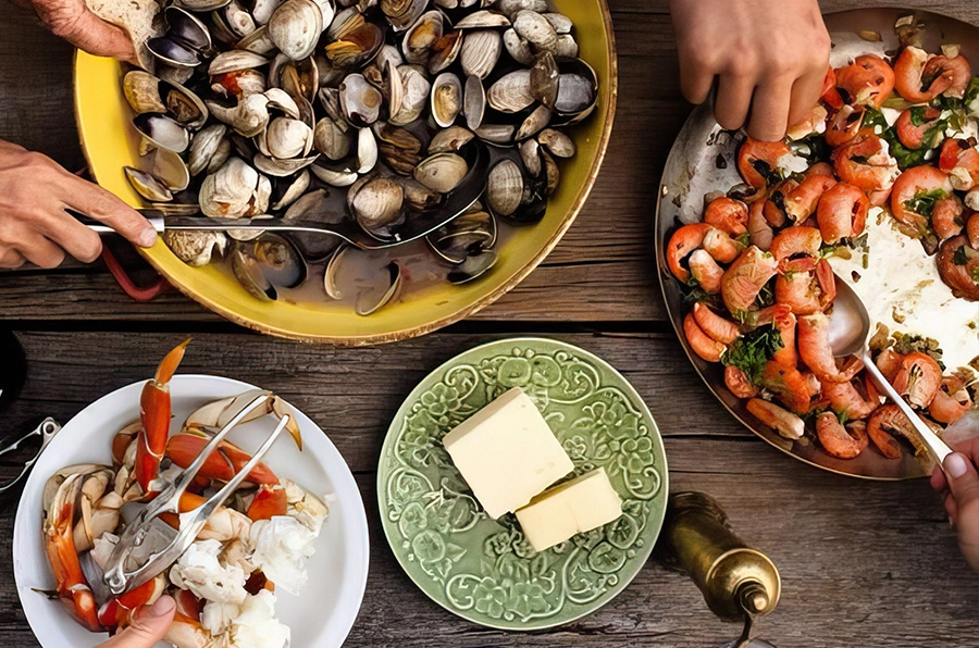 portugal seafood on table with people using utencils