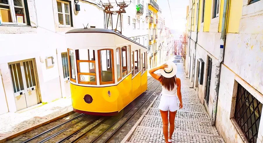 portugal woman walking beside building yellow tram in road