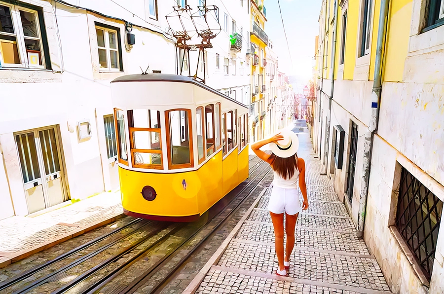 portugal woman walking beside building yellow tram in road